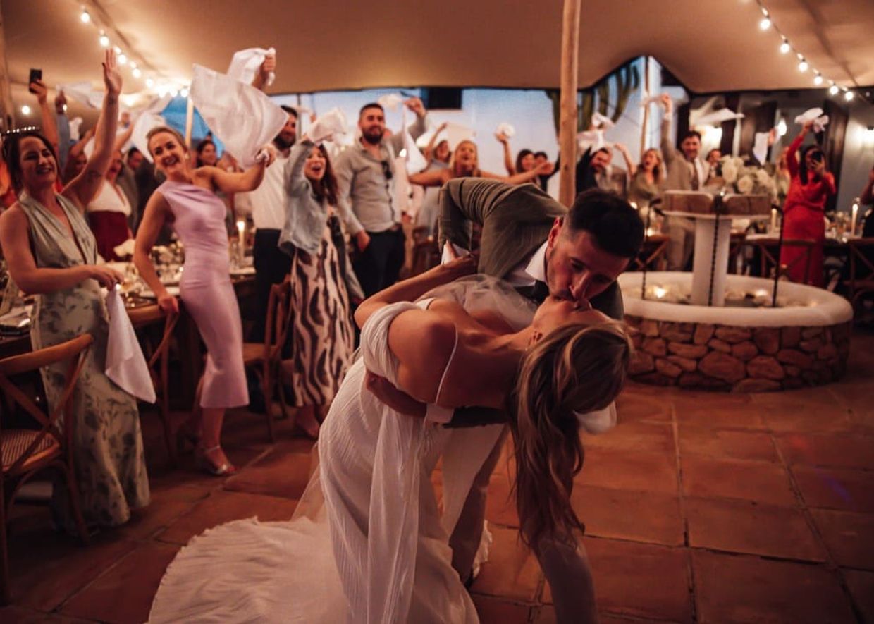 Wedding couple kissing at their wedding in Las Cicadas Ibiza