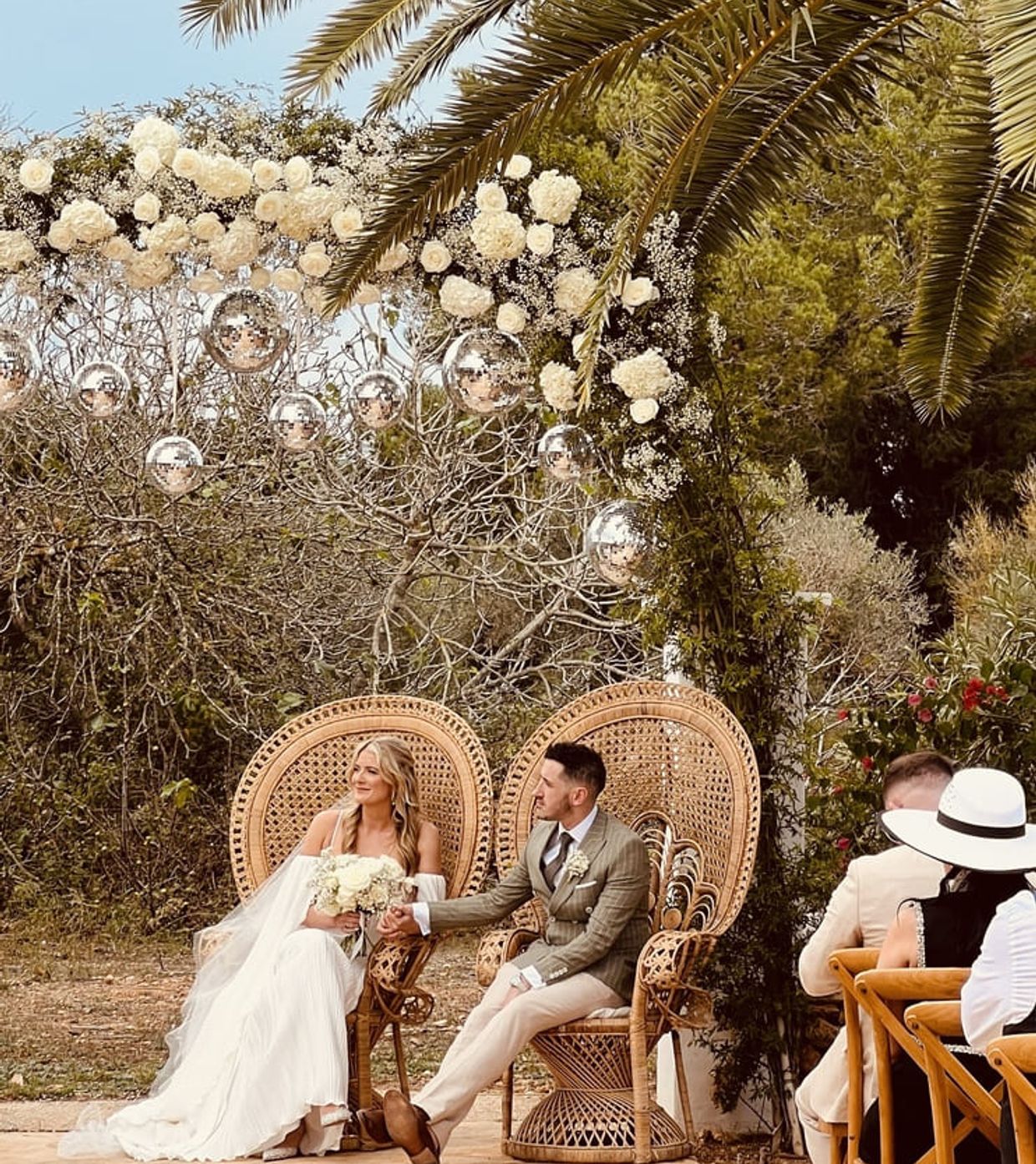 Las Cicadas Wedding ceremony, Ibiza wedding couple, getting married in ibiza, wedding arch with flowers and disco balls